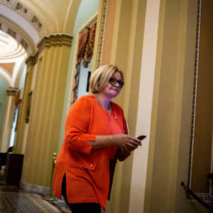 Senator Claire Mccaskill Walking Through Capitol Hill Wallpaper
