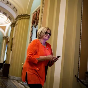 Senator Claire Mccaskill Walking Through Capitol Hill Wallpaper