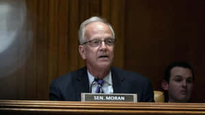 Senator Jerry Moran Delivering A Speech Wallpaper