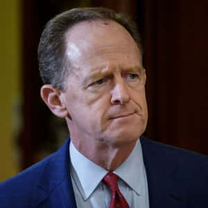 Senator Pat Toomey With A Serious Expression Wallpaper