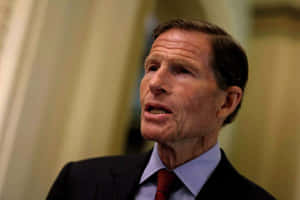 Senator Richard Blumenthal Against A Yellow Backdrop Wallpaper