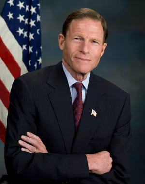 Senator Richard Blumenthal Posing With Crossed Arms Wallpaper