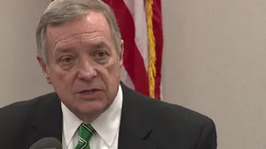 Senator Richard Durbin Delivering A Speech Into A Microphone. Wallpaper