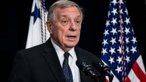 Senator Richard Durbin In Front Of American Flags Wallpaper