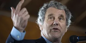 Senator Sherrod Brown Intensely Speaking During A Public Speech Wallpaper