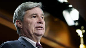 Senator Speakingat Event Wallpaper