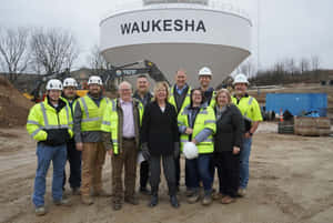 Senator Tammy Baldwin Interacting With Workers Wallpaper