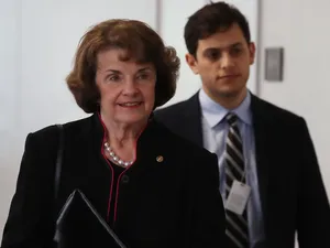 Senior U.s. Senator Dianne Feinstein Accompanied By A Bodyguard Wallpaper