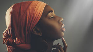 Serene African Woman With Eyes Closed Wallpaper