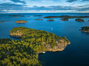 Serene Archipelago Sailing Wallpaper