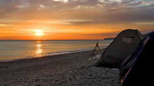Serene Beach Camping Experience Wallpaper