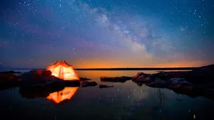 Serene Beach Camping Under The Stars Wallpaper