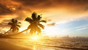 Serene Beach Sunset In Paradise Wallpaper