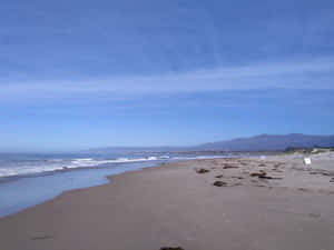 Serene Beach With Golden Sand Wallpaper