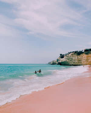 Serene_ Beachscape_with_ Swimmers.jpg Wallpaper