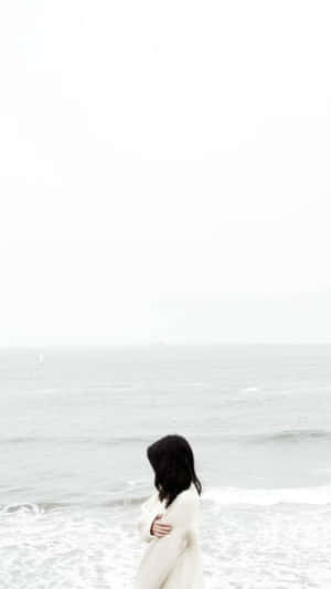 Serene_ Beachside_ Contemplation.jpg Wallpaper