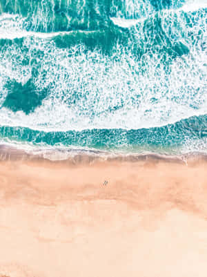 Serene Beige Beach Aerial View.jpg Wallpaper