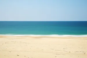 Serene Beige Beachscape Wallpaper