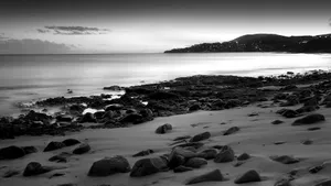 Serene Black And White Beach Wallpaper