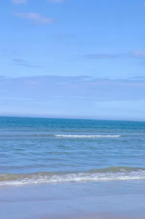 Serene Blue Beach Scape Wallpaper