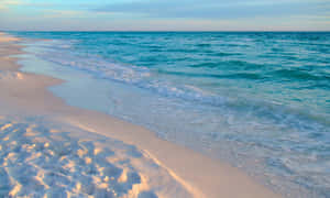 Serene Blue Beach Sunset Wallpaper