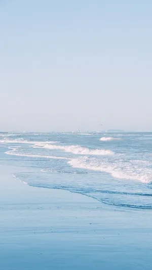 Serene Blue Beach Waves Wallpaper