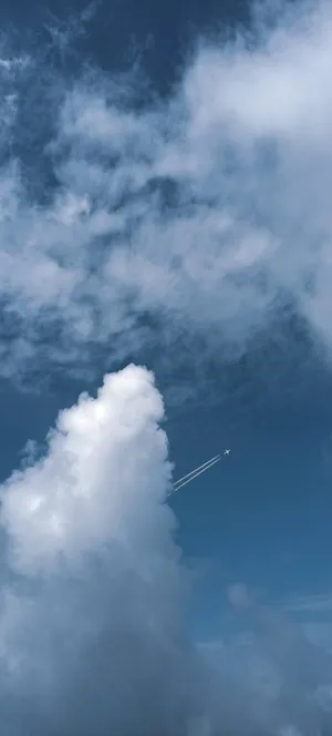 Serene_ Blue_ Sky_with_ Airplane Wallpaper