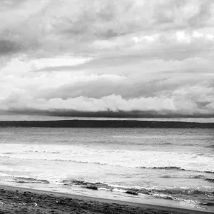 Serene Escape On A Black And White Beach Wallpaper