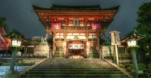 Serene Feudal Japanese Village With Majestic Castle In Background Wallpaper