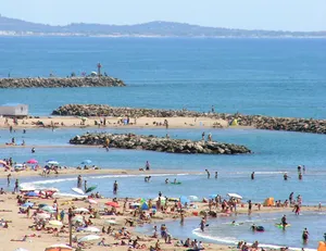 Serene French Beach At Sunset Wallpaper