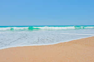 Serene French Beach With Crystal Clear Waters Wallpaper