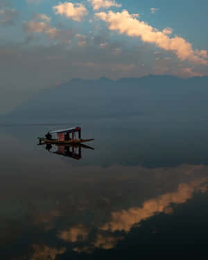 Serene Lake Boat Reflection Wallpaper