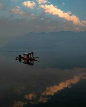Serene Lake Boat Reflection Wallpaper