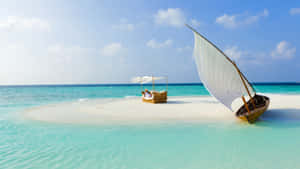 Serene Maldives Beach At Sunset Wallpaper