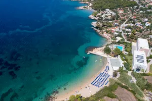 Serene Mediterranean Beach At Sunset Wallpaper