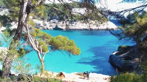 Serene Mediterranean Beach At Sunset Wallpaper