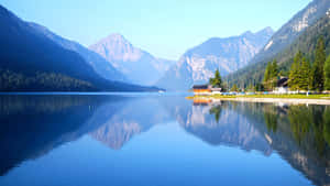 Serene_ Mountain_ Lake_ Reflections.jpg Wallpaper