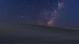 Serene Night Sky Illuminated By Dazzling Stars Wallpaper