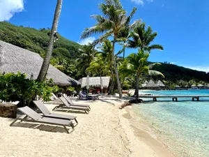 Serene Overwater Bungalows At Bora Bora Beach Wallpaper