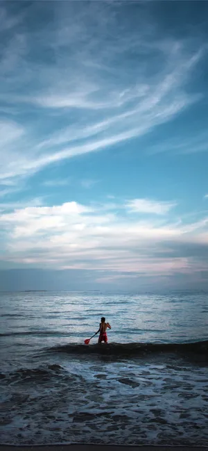 Serene Paddleboarding Adventure Wallpaper