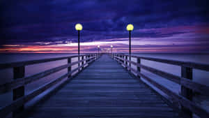 Serene Purple Sunset At The Coast Wallpaper