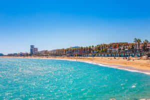 Serene Sunset At A Beautiful Spanish Beach Wallpaper