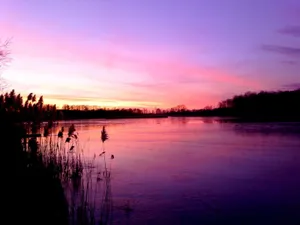 Serene Sunset Landscape With Pink Sky Wallpaper