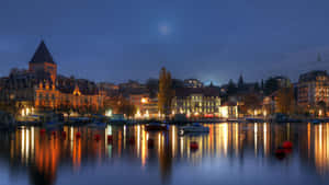 Serene Sunset Over The Picturesque City Of Lausanne, Switzerland Wallpaper