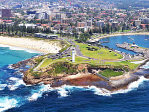 Serene Sunset Over Wollongong Beach Wallpaper