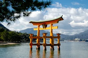 Serene Torii Gate By The Water Wallpaper