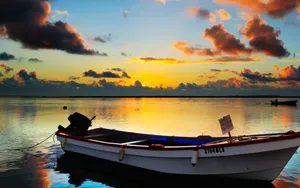 Serenity At Sea: Solo Boat Journey Wallpaper