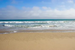 Serenity Of The Beach - An Exquisite Display Of Nature's Beauty Wallpaper