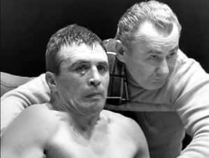 Serious Face Of Gustav Scholz Above The Boxing Ring Wallpaper