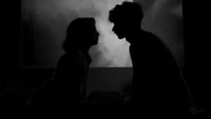 Shadowed Lovers Embrace Wallpaper